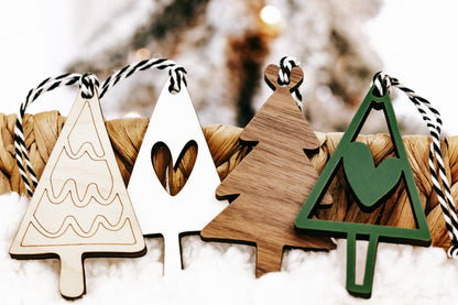 Mix of wooden Christmas ornaments in green and natural finishes with stripe rope hangers