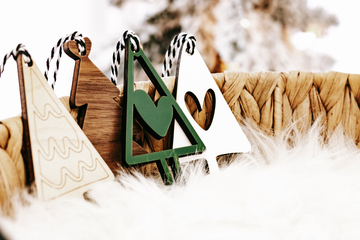Wooden Christmas tree ornament with green frame and natural wood backing, stripe cord hanger