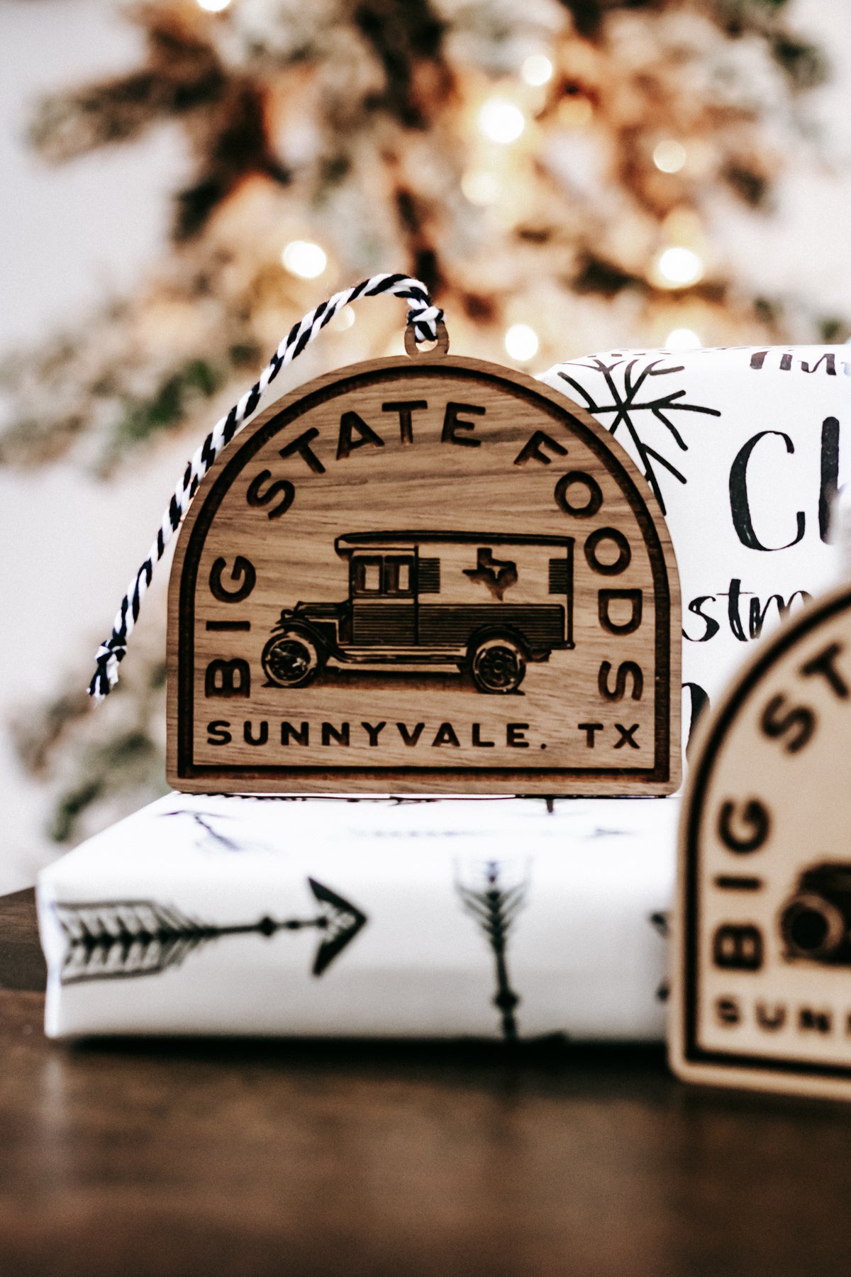 Round wooden ornament with printed van logo and “Big State Foods / Sunnyvale, TX” text.