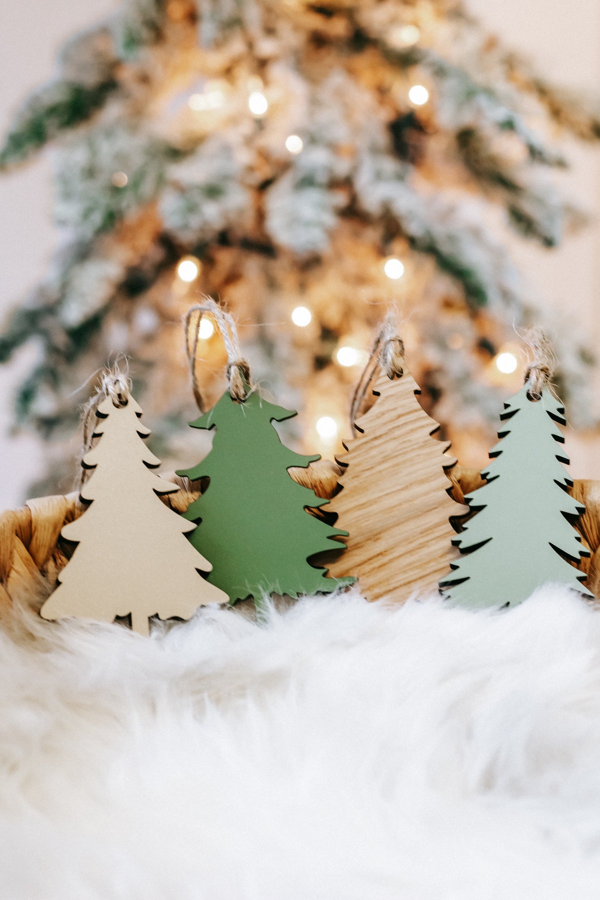 Wooden Christmas tree ornaments in green and natural wood with hanging twine