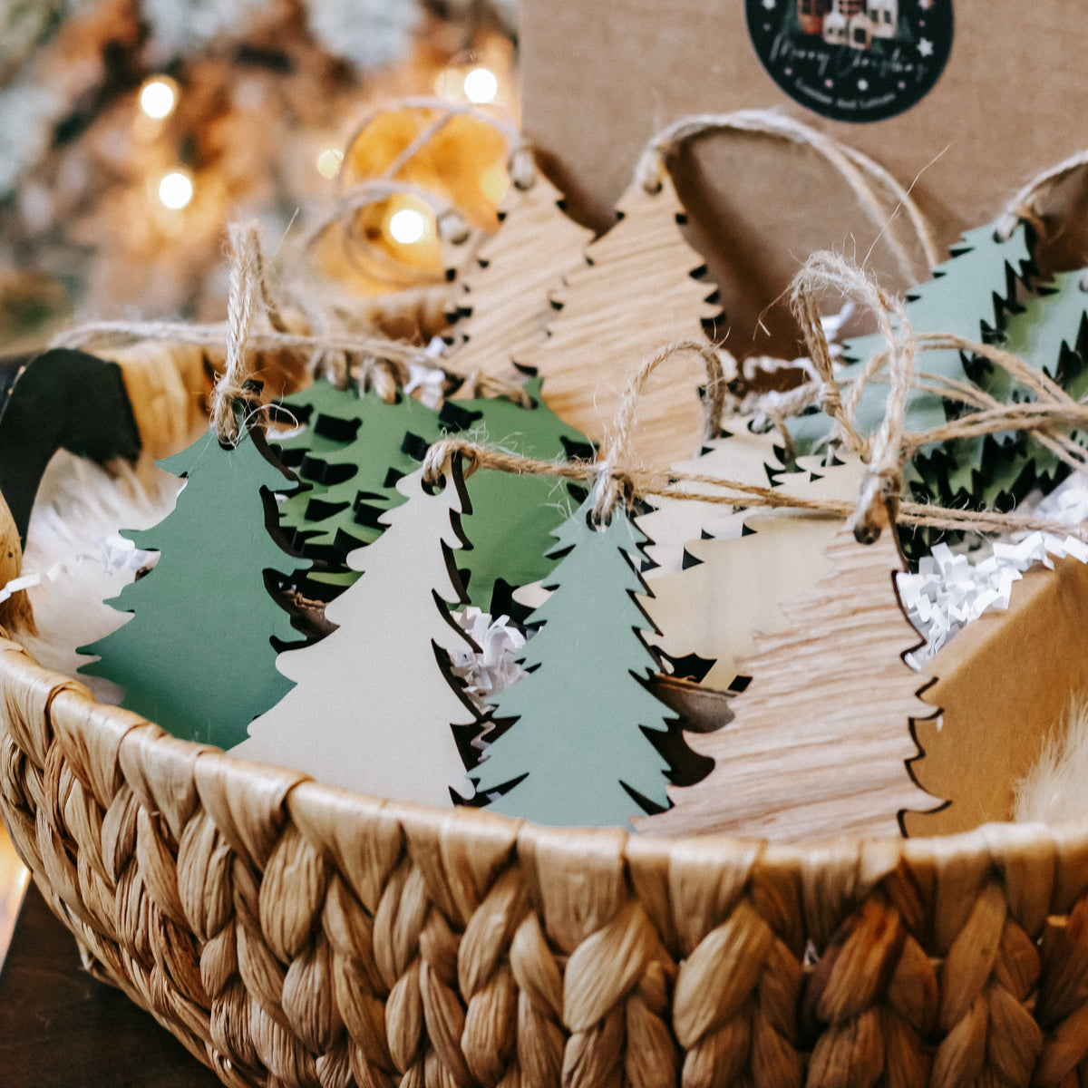 Wooden Christmas tree ornaments on twine, mix of green and natural wood tones