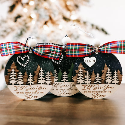 Memorial Christmas ornaments with plaid bows and name TERRI, featuring pine trees and starry background.