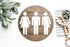 Round wood-look restroom sign with white unisex toilet icons for women, men, and all-gender