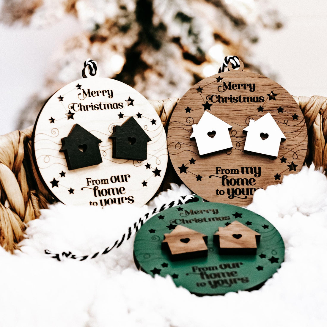 Round wooden Christmas ornaments with house and heart cutouts, “Merry Christmas” text