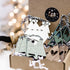 Set of wooden Christmas tree ornaments in kraft box with striped hanging strings