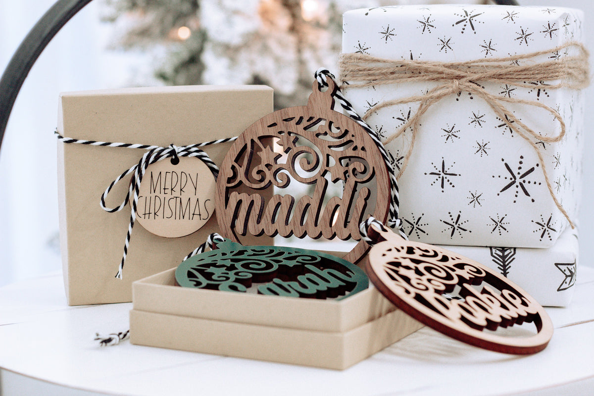 Wooden personalized name ornament with star cutouts, &