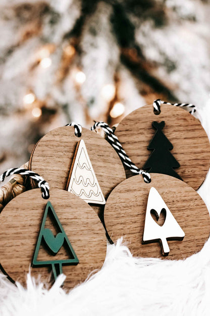 Wooden ornament set with tree, heart, and star shapes on striped string hangers