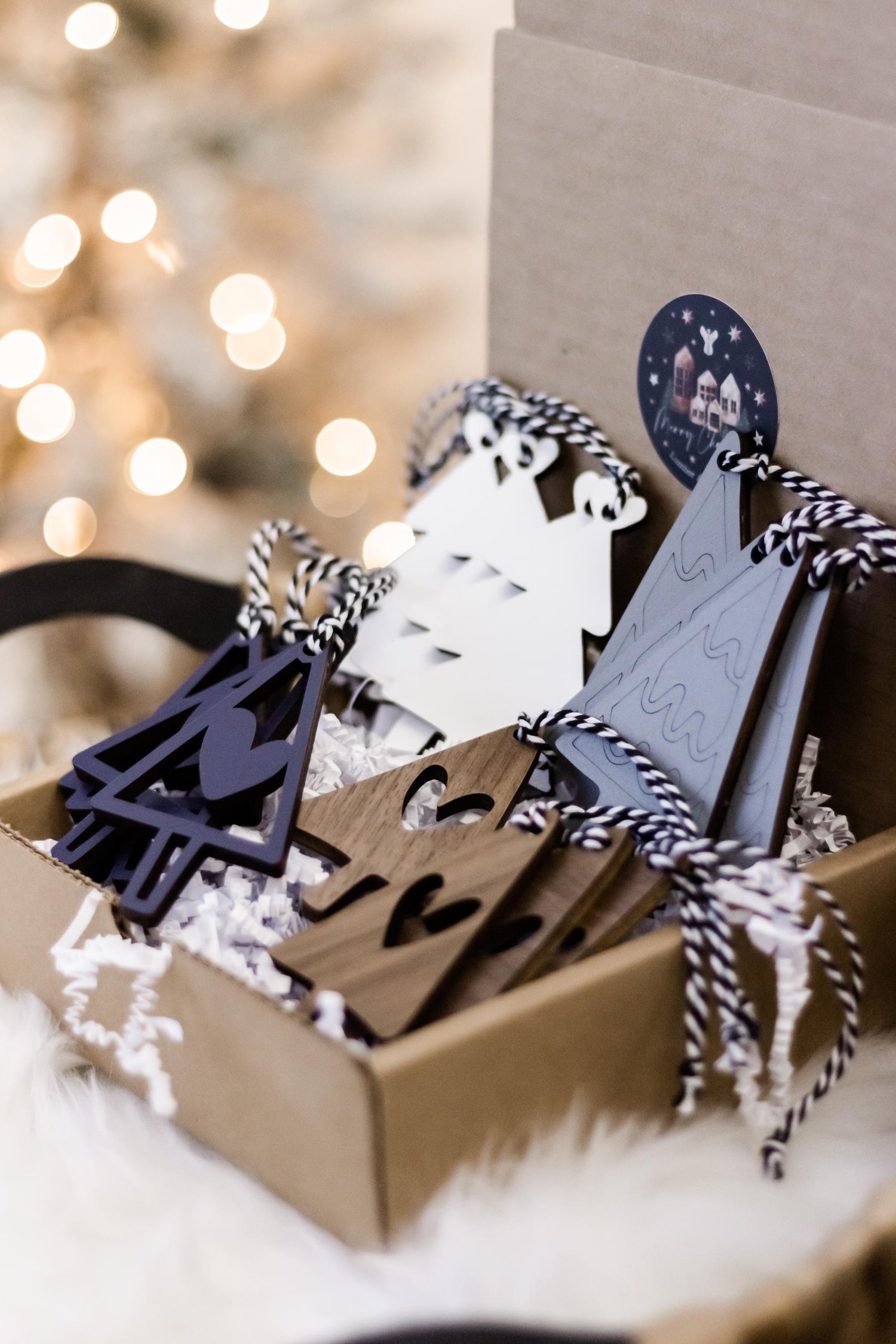 Wooden Christmas tree ornament set with navy tree cutout and gray engraved tag