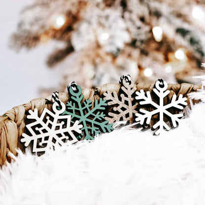 Set of 16 snowflake tree ornaments, black-and-white wood snowflakes with dark green center