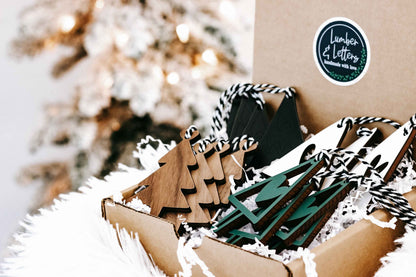 Assorted wooden Christmas ornaments in a box, natural wood and dark green, on faux fur