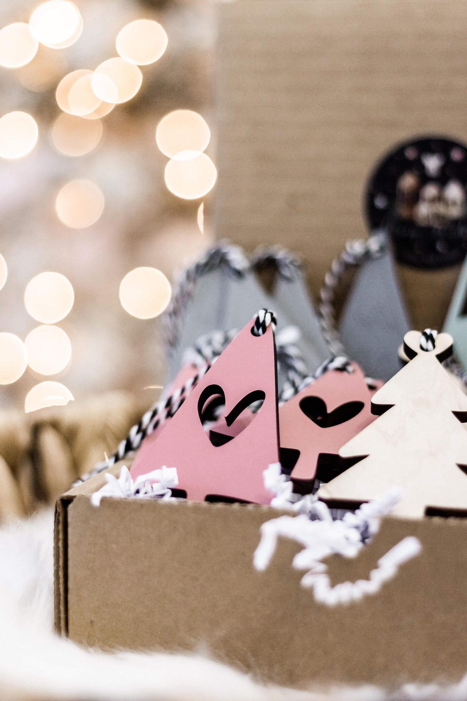Boho Christmas ornaments: blush pink tree and white star in kraft box with rope hangers