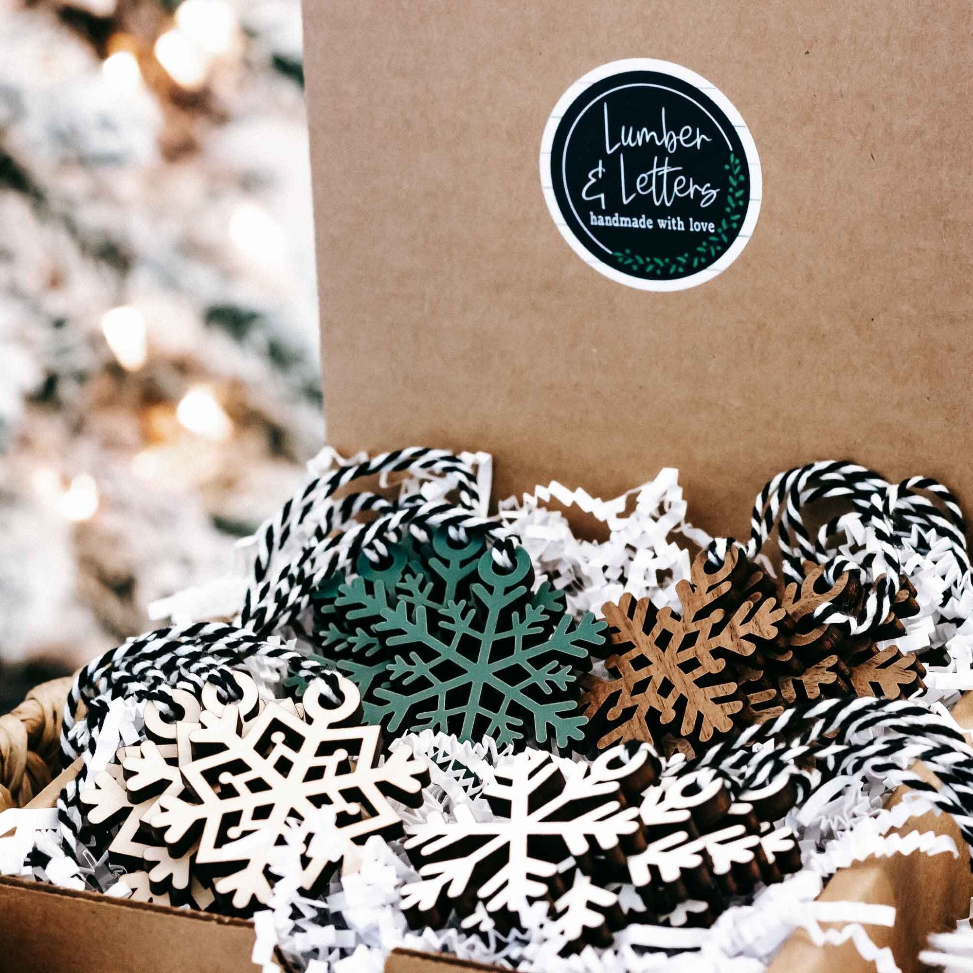 Set of 16 snowflake tree ornaments, striped and green wood cutouts with twine