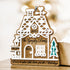 Wood gingerbread house ornament with “2023” and “Gonzalez Family,” teal tree cutout