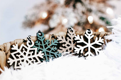 Set of 16 snowflake tree ornaments, dark wood cutout snowflakes with green accents