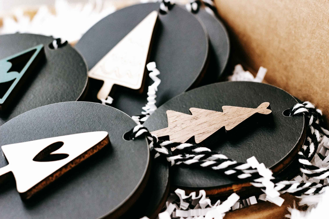 Black and natural wood Christmas ornament set with tree and star cutout designs
