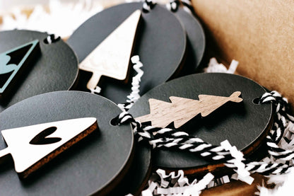 Black and natural wood Christmas ornament set with tree and star cutout designs