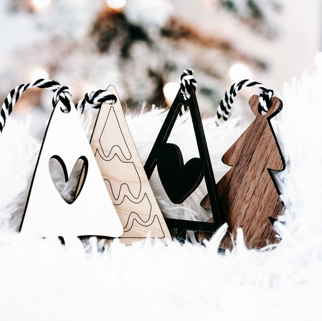 Boho Christmas tree ornaments set with wood, black, and white shapes plus striped string hangers