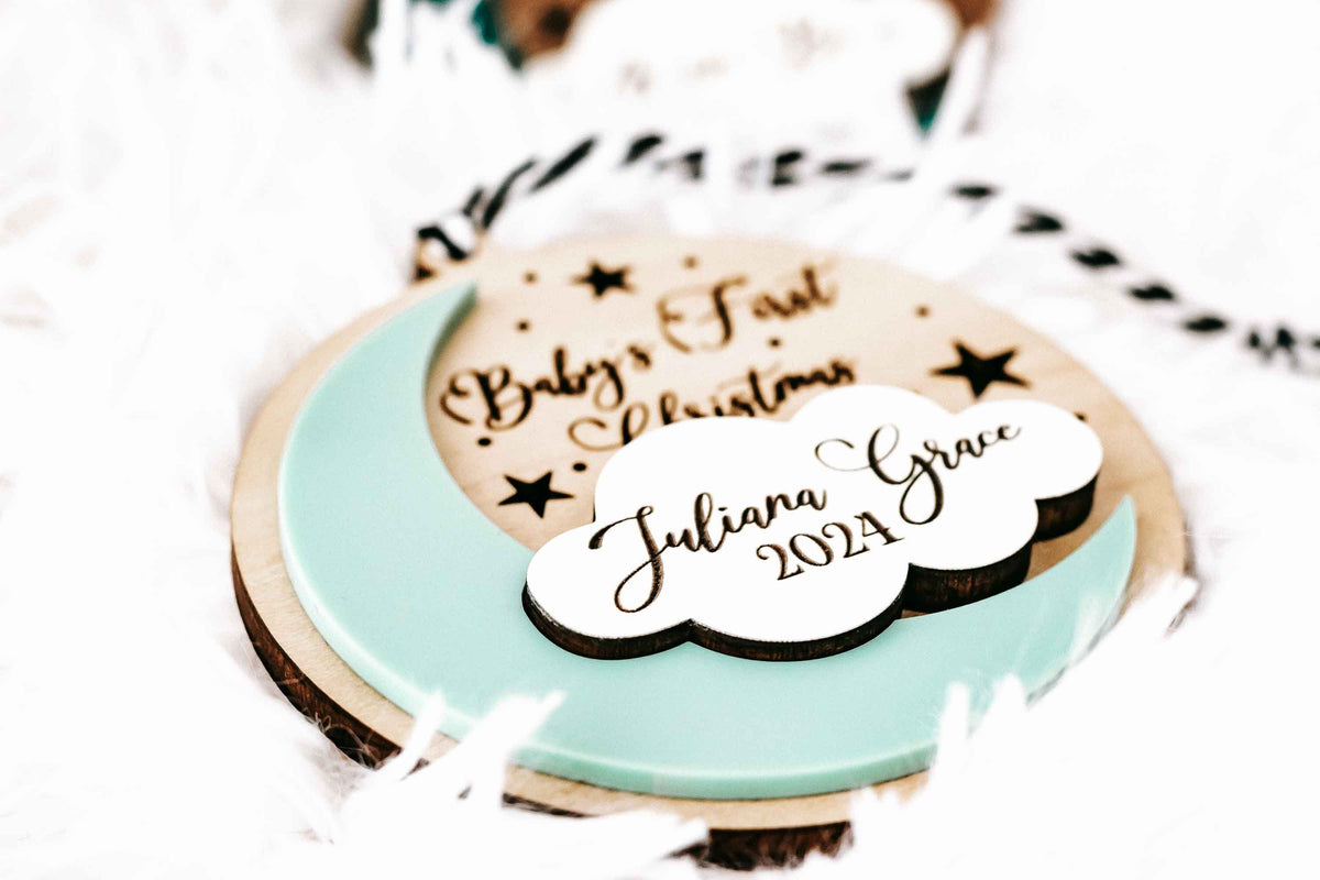 Personalized Baby’s First Christmas ornament, turquoise and tan round with engraved name and 2024