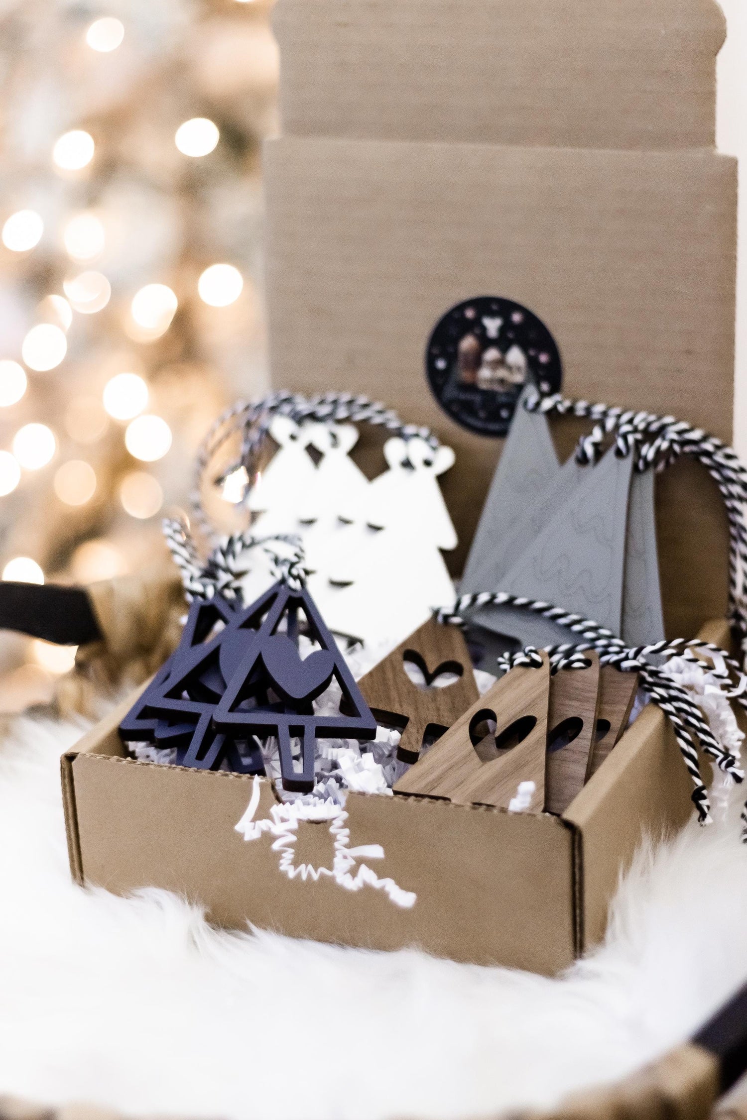 Wooden Christmas tree ornament set with navy tree cutouts and gray tag shapes