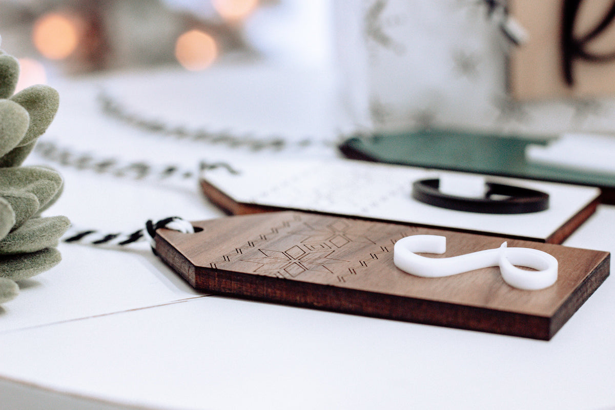 Personalized wooden stocking tag with white letter 8 and Nordic etched pattern