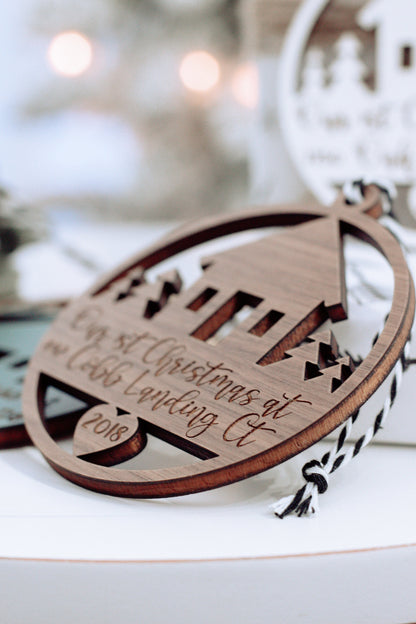 Oval wooden Christmas ornament with laser-cut arch design and hanging loop