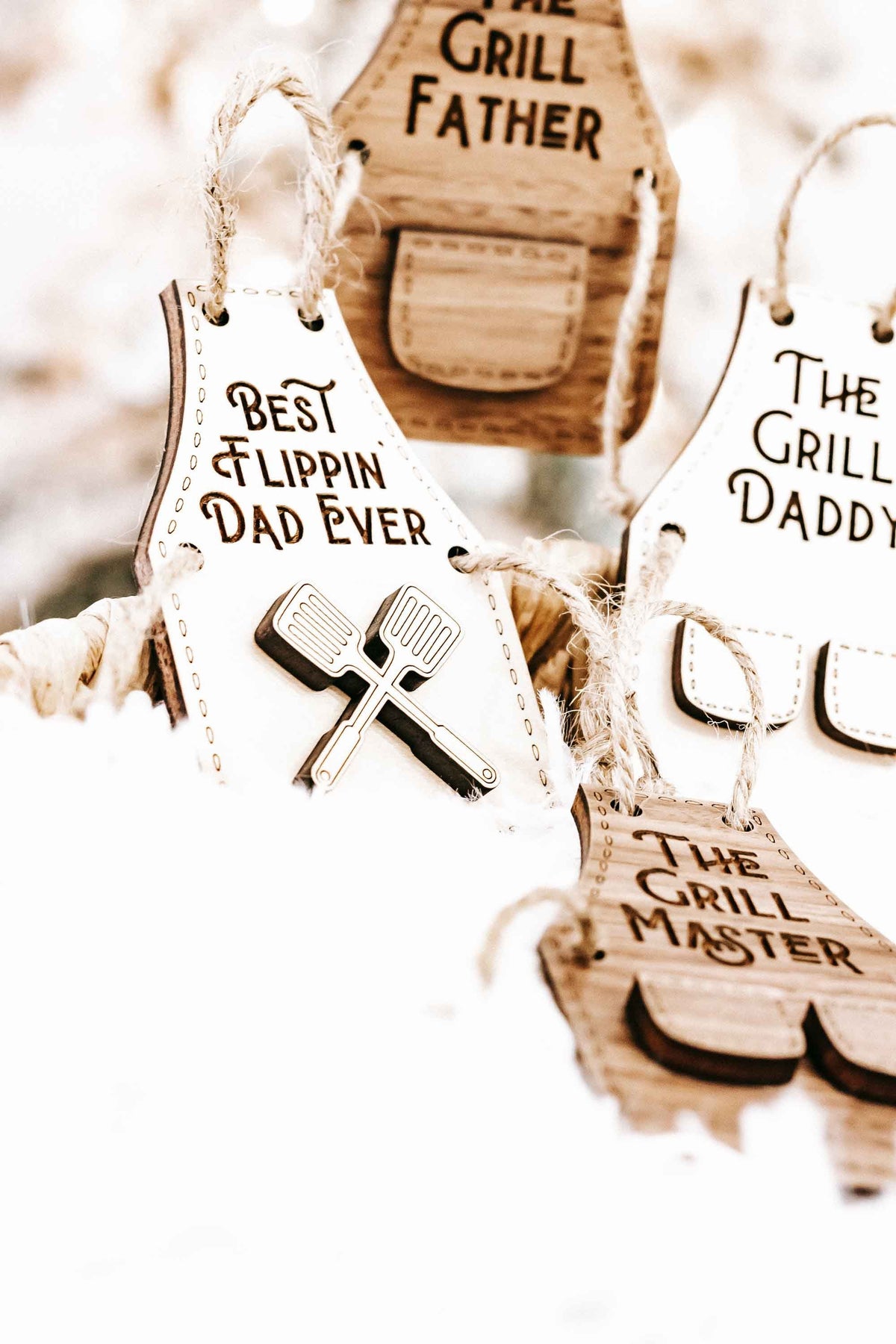 Wood ornaments featuring “Best Flippin’ Dad Ever,” “The Grill Father,” and “The Grill Daddy.”
