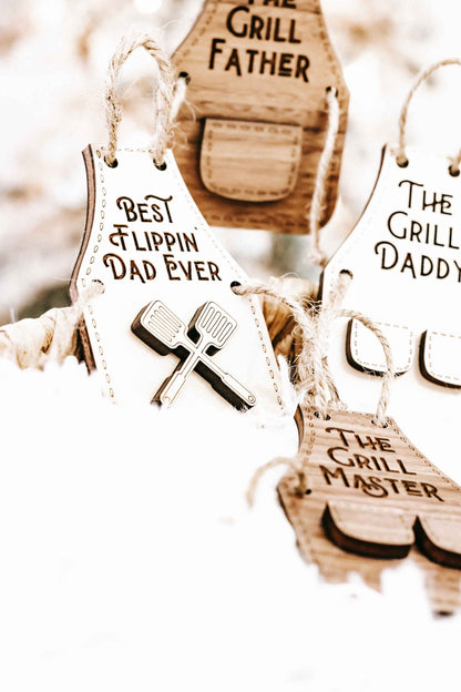 Wood ornaments featuring “Best Flippin’ Dad Ever,” “The Grill Father,” and “The Grill Daddy.”