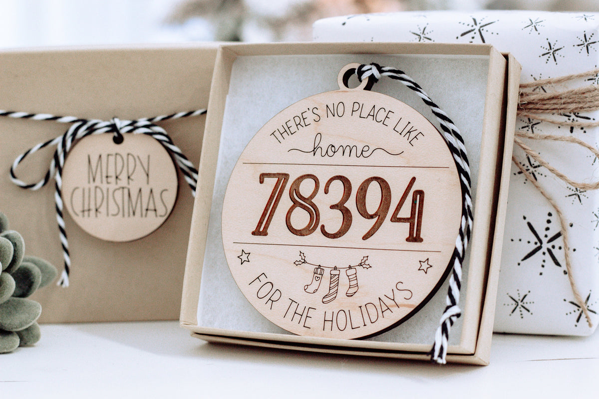 Round personalized home holiday ornament in white wood with “78394” in orange.