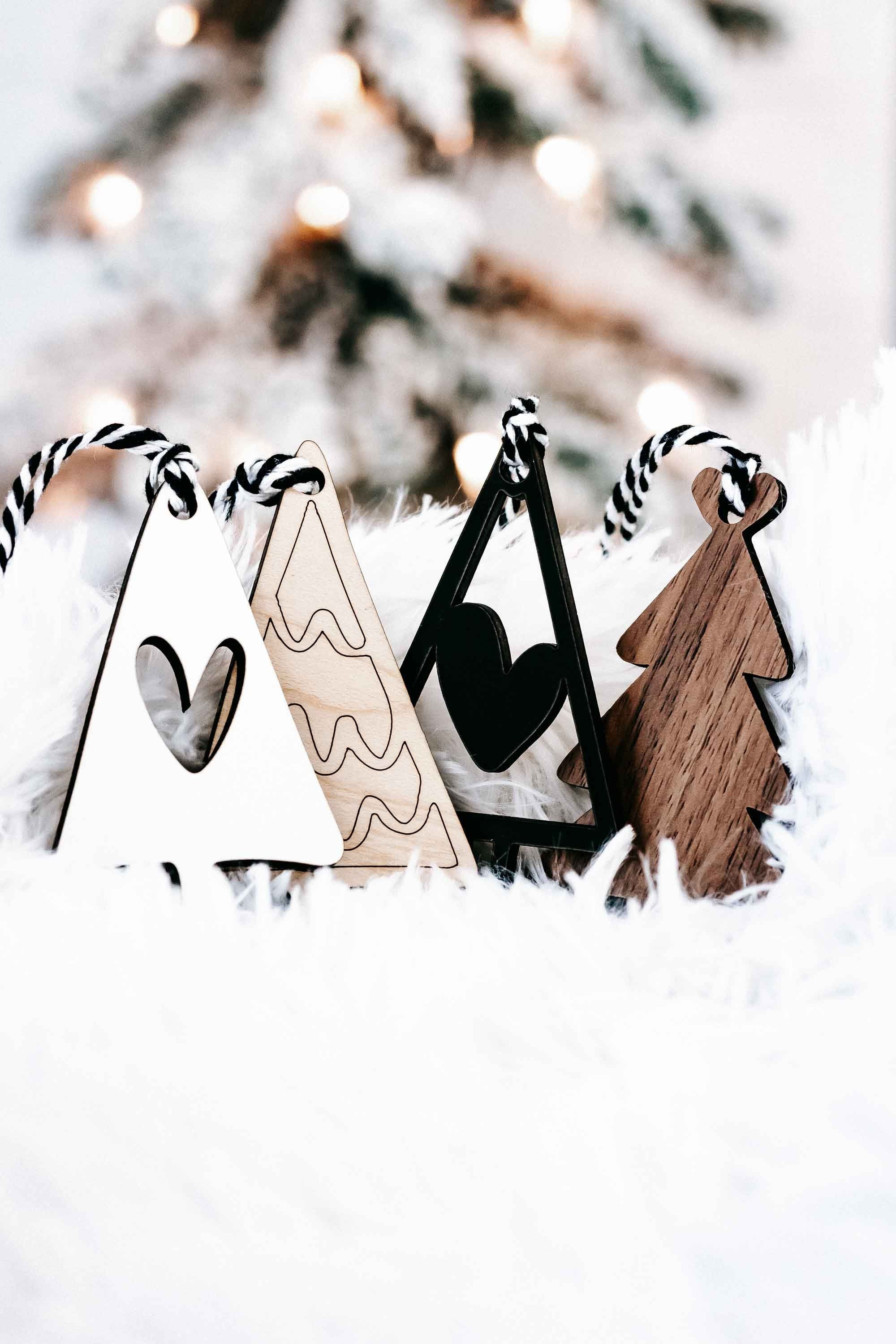 Boho Christmas tree ornaments set with striped rope hangers in wood, white, and black triangle trees