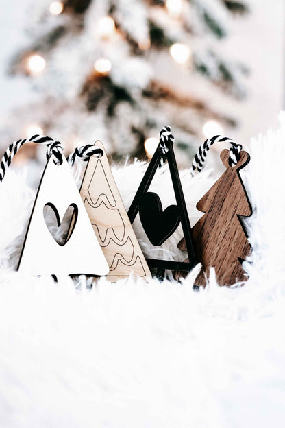 Boho Christmas tree ornaments set with striped rope hangers in wood, white, and black triangle trees