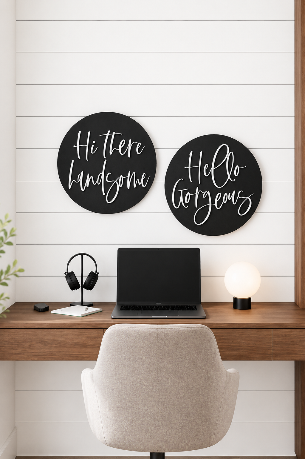 Two round black wall signs with white cursive text: “Hi there handsome” and “Hello gorgeous”.