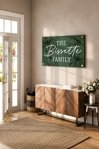 Dark green rectangular engraved family name sign with bird-and-floral design: THE Bissette FAMILY