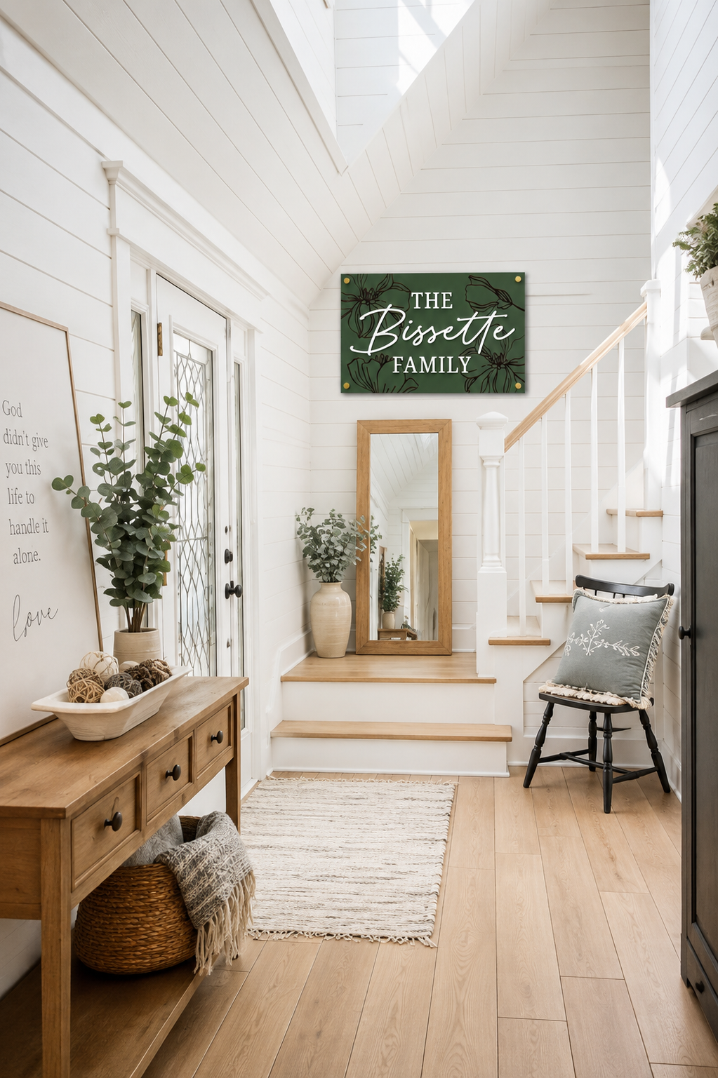 Dark green rectangular family name sign with bird-and-floral engraving: THE Bissette