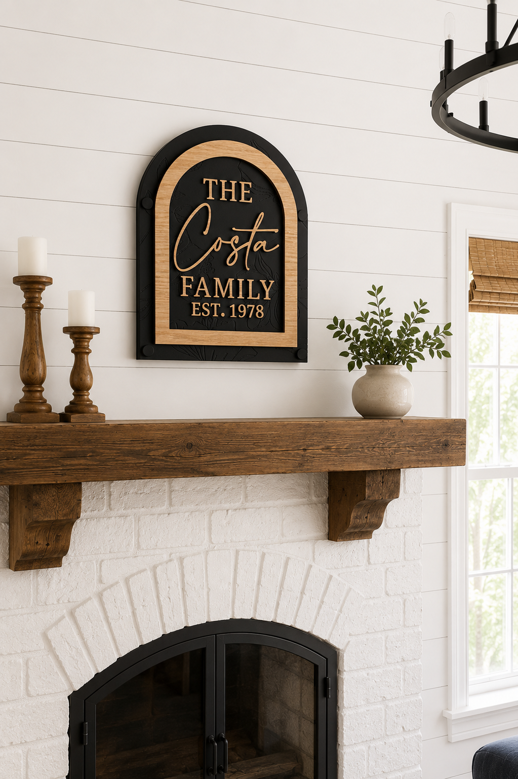 Framed arch family name sign on wall, black panel with gold The Costa and Est. 1978