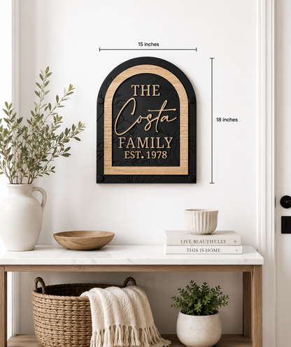 Framed black arch family name sign with gold text “THE Costa FAMILY EST. 1978”.