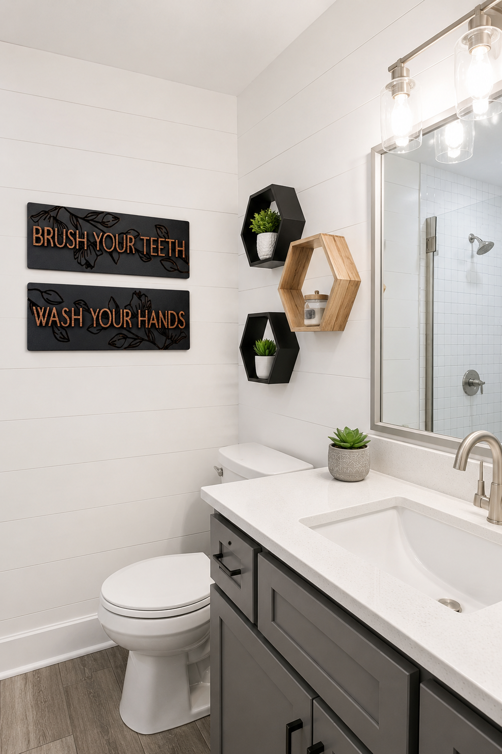 Two engraved wall plaques in black with gold Brush Your Teeth and Wash Your Hands