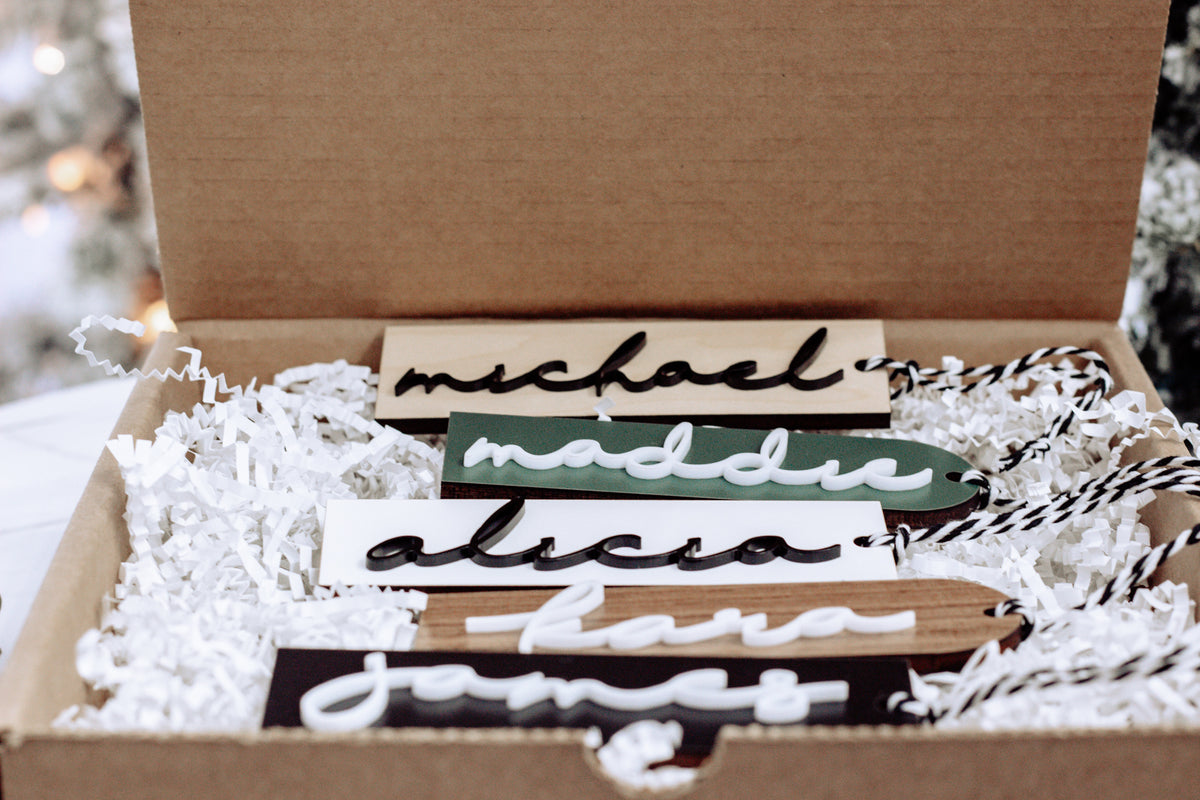 Personalized stocking name tags with wood and paper letters in a gift box