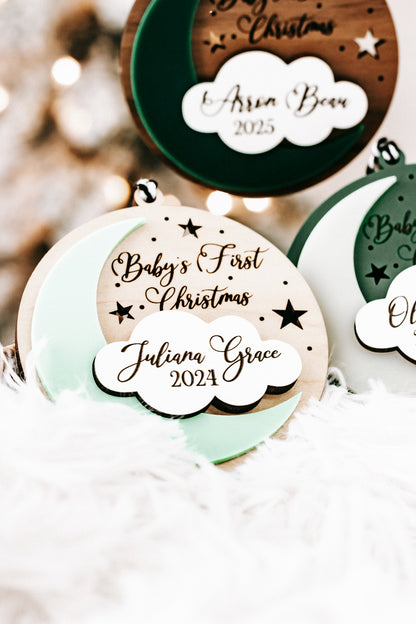 Close-up: white hanging round ornament with white cloud tag for Juliana Grace, 2024.