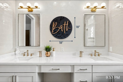 Engraved bath sign with cursive “Bath” text on round black plaque