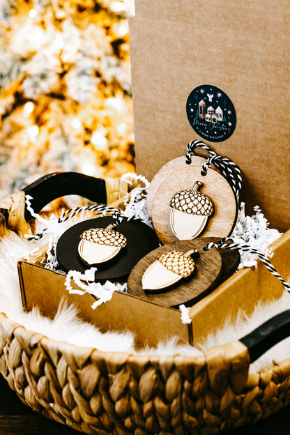 Round acorn Christmas ornament with dark sky house design, rope loop hanger and acorn cap