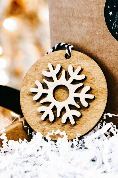 Wooden round snowflake ornament, light wood with white cutout snowflake