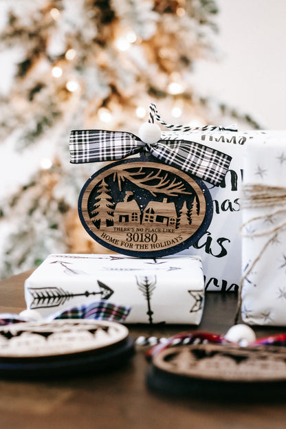 Round wood Christmas ornament with 30180 zip code, house scene, and black plaid bow