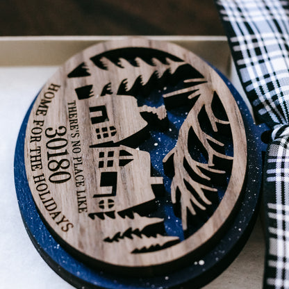 Round wood ornament close-up showing 30180 and “Home for the Holidays”