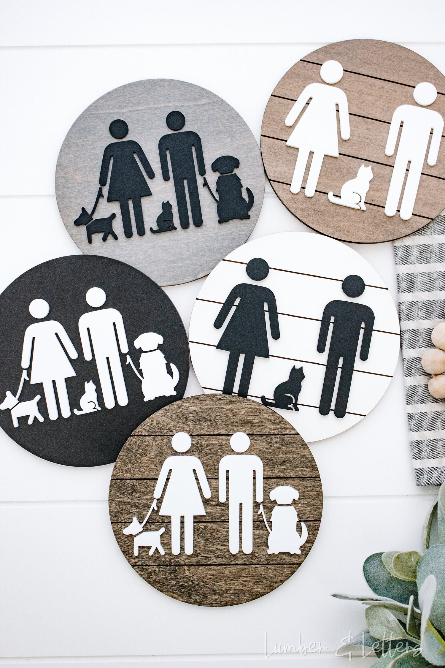 Round restroom sign with pet silhouettes, shown in multiple color circles (gray, tan, black)