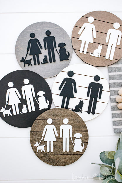 Round restroom sign with pet silhouettes, shown in multiple color circles (gray, tan, black)